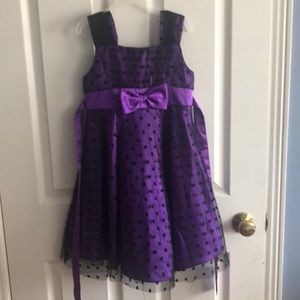 purple children’s dress with polka dots